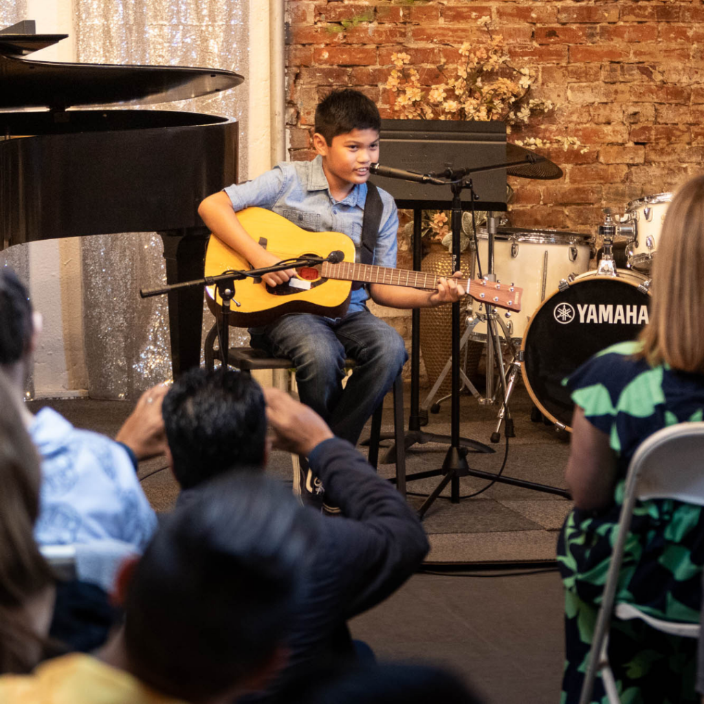 kid playing guitar lessons in la canada and la Crescenta montrose